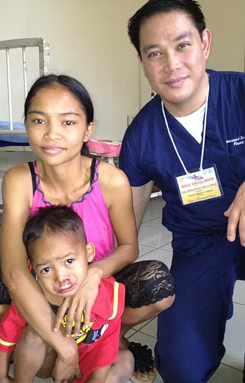 Healthcare professional with mother and child.