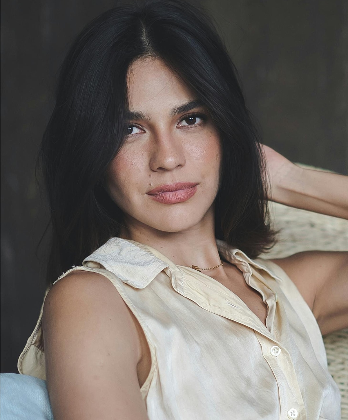 Model showcasing sheer lingerie from behind.