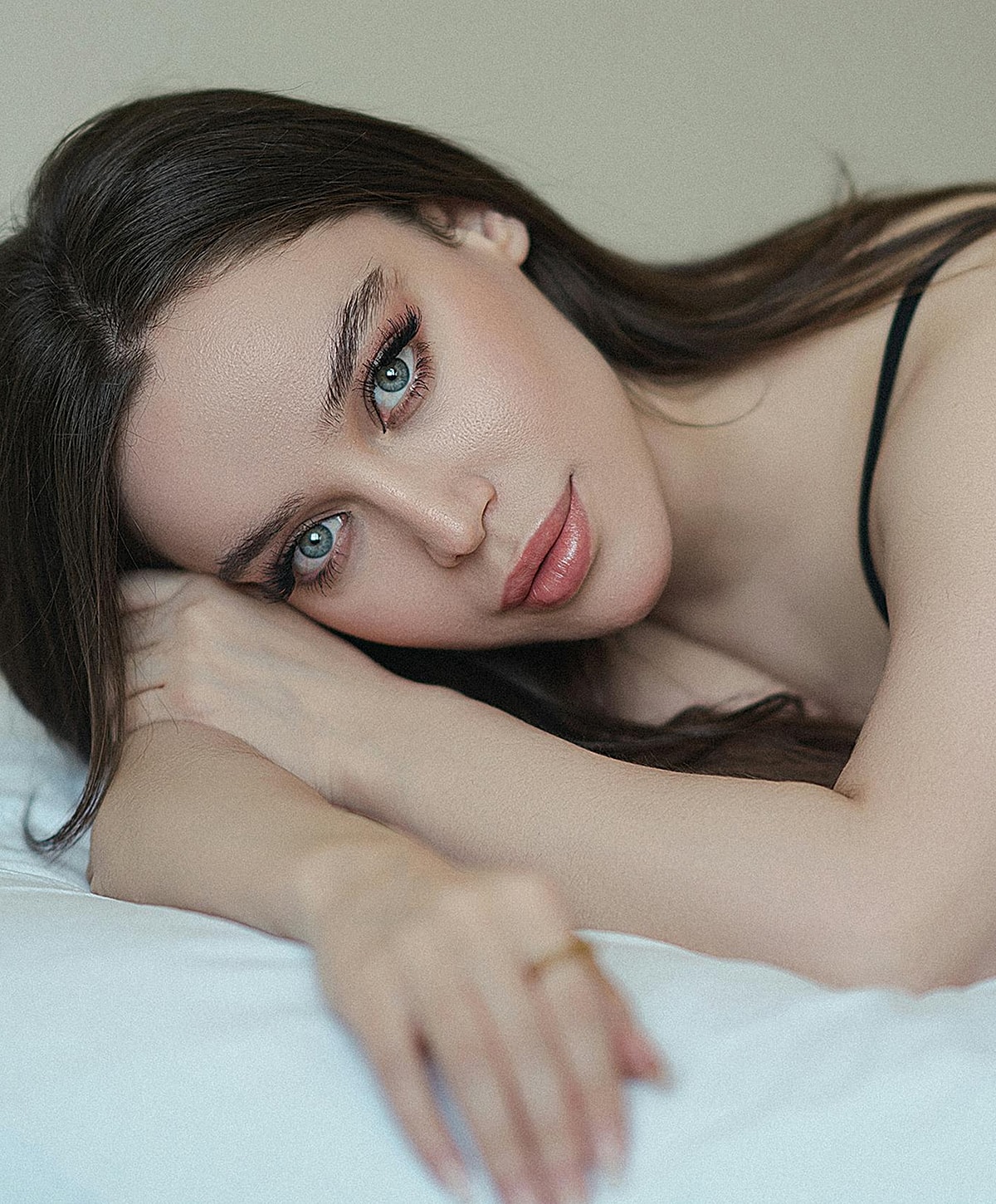 Portrait of a woman with striking blue eyes.