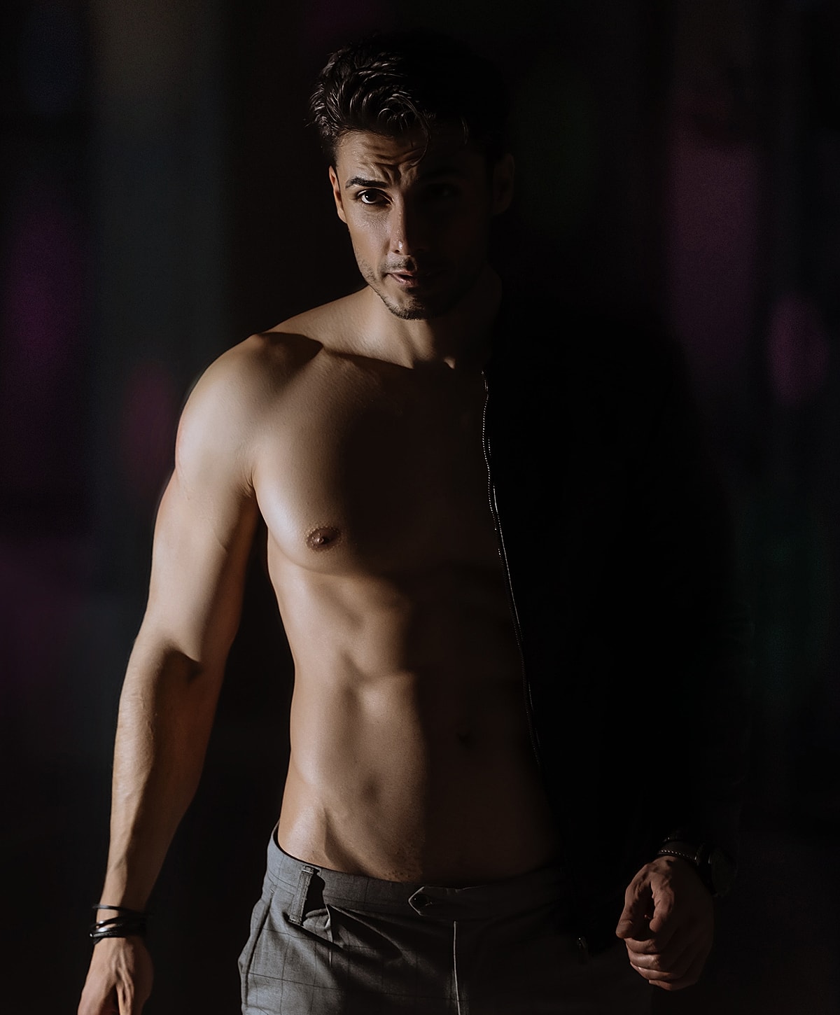 Woman in lace lingerie posing indoors.