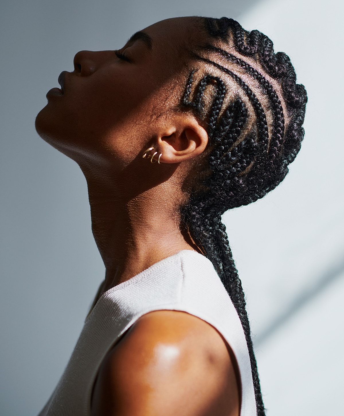 Model poses in a stylish black swimsuit.