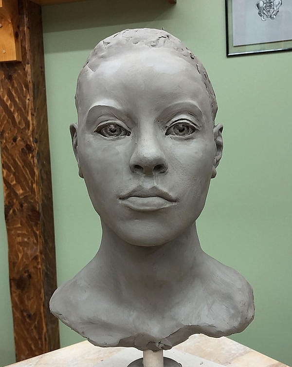 Sculpted clay head of a human figure