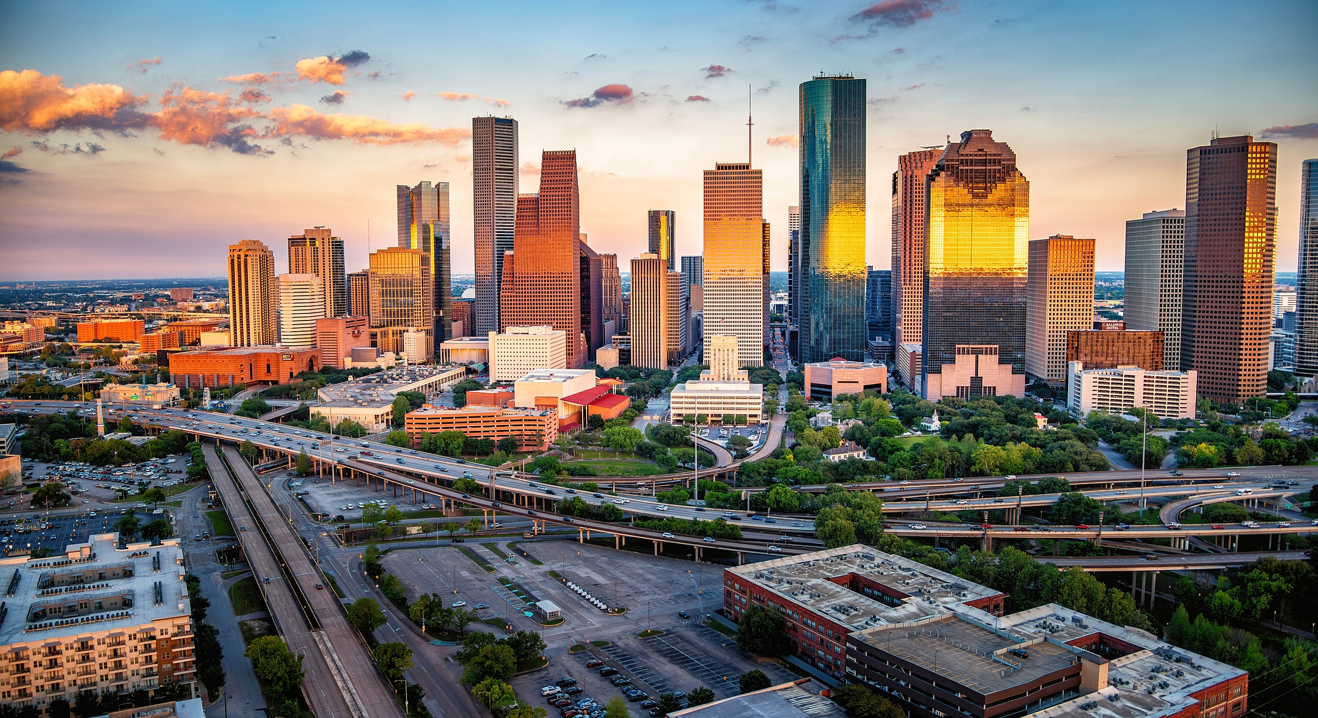 Houston skyline at sunset with highways below
