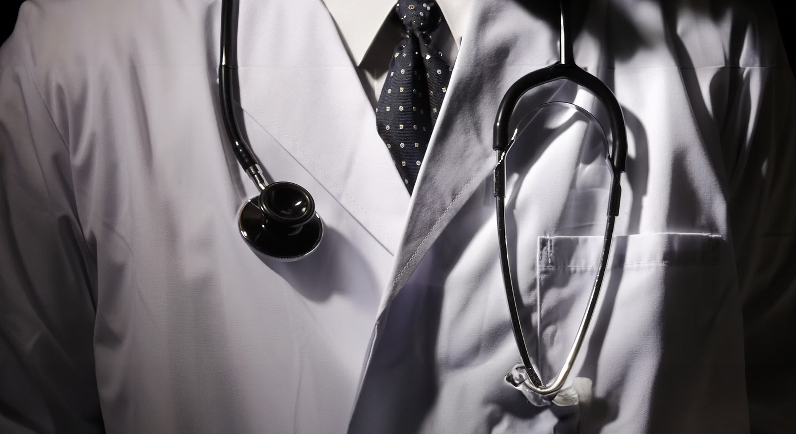 Doctor in a white coat with stethoscope.