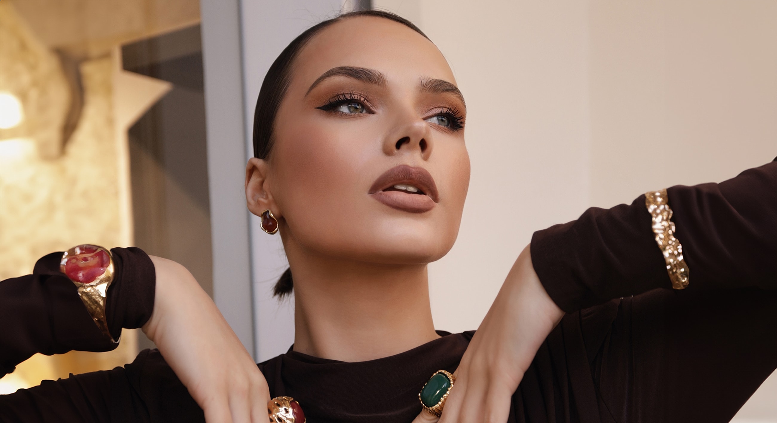 Fashionable woman showcasing elegant jewelry.