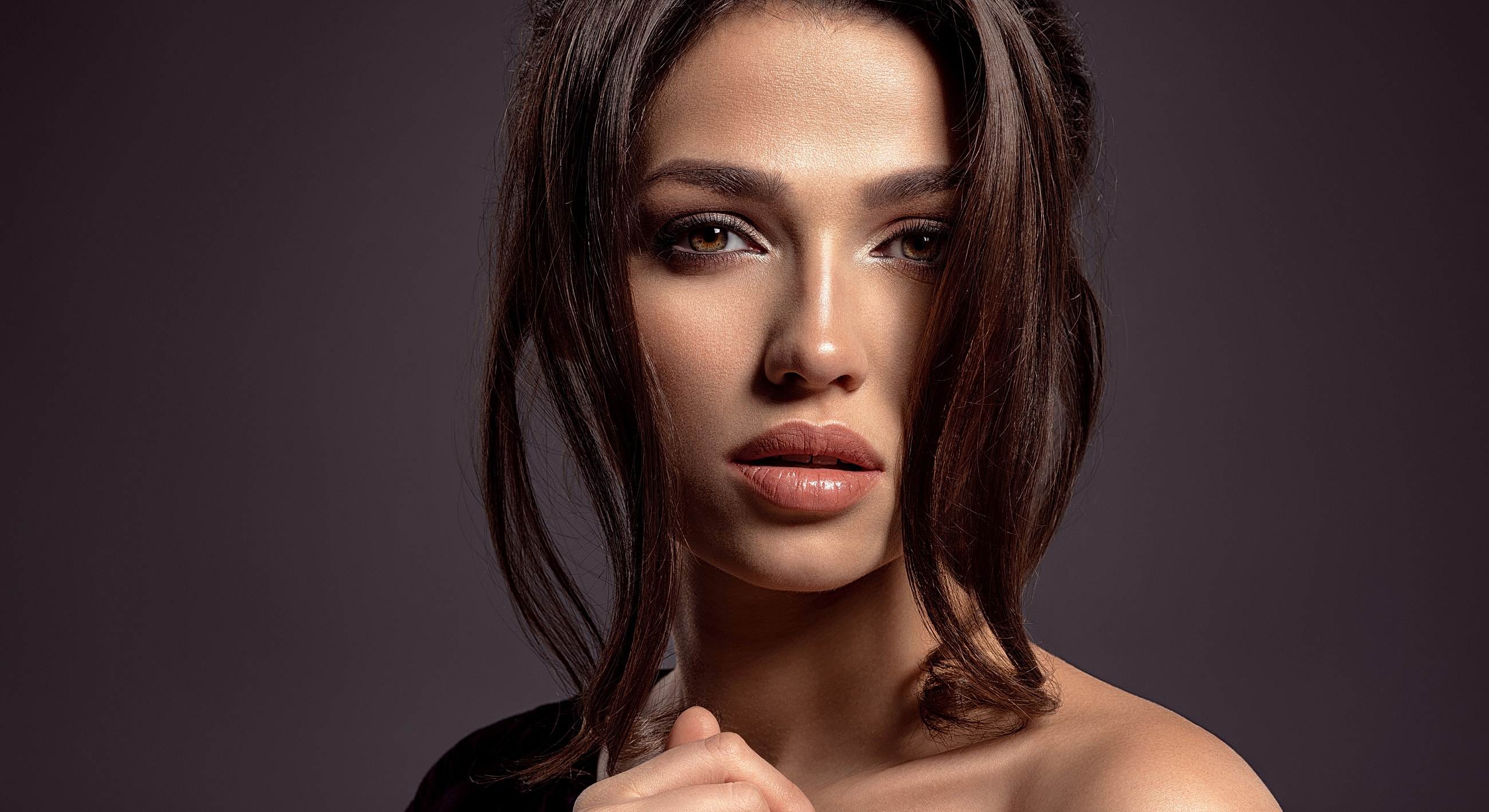 Portrait of a woman with flowing hair.
