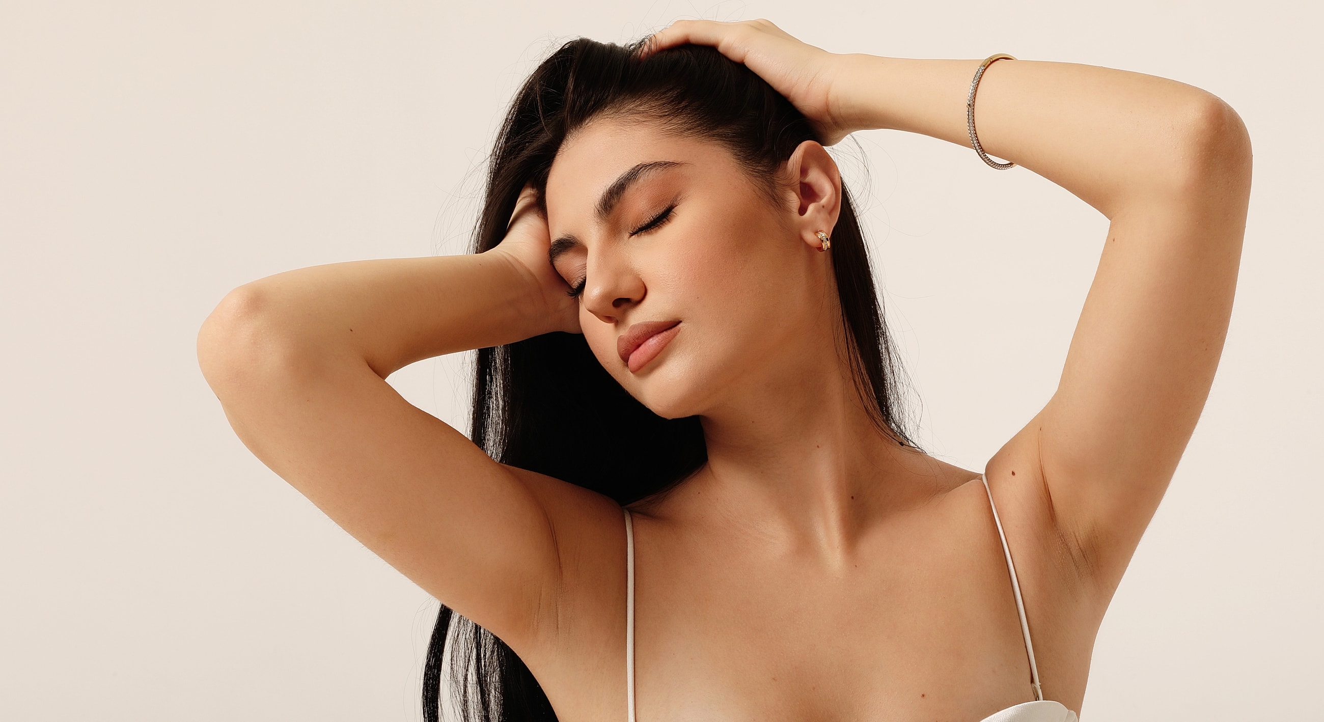 Woman with long hair posing gracefully.